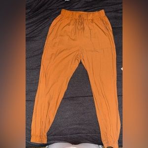 A tan colored pair of joggers size petite, medium from Shein.